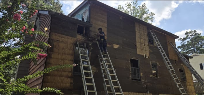 Multi-level ladder work, siding removal, and structural exterior wall repair by Quality Painting & Home Repairs in Rockmart GA