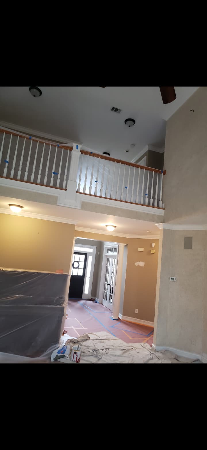High-ceiling interior painting prep, masked floors, crown molding and balcony railing work in Rockmart GA