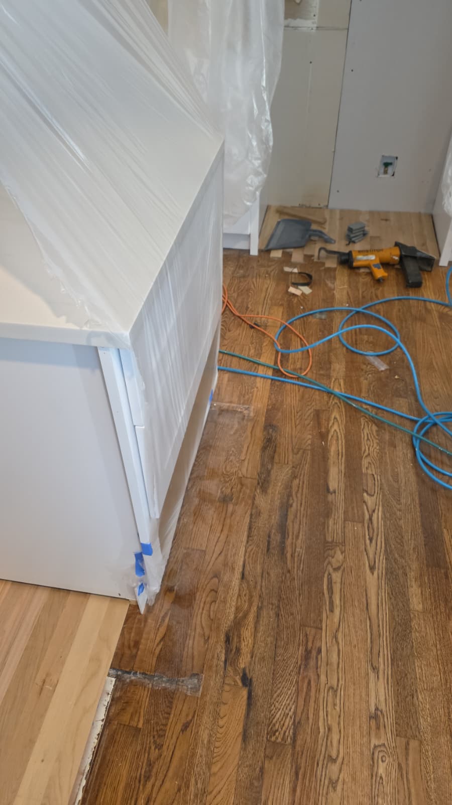 Hardwood plank flooring installation and kitchen island cabinet carpentry by Quality Painting & Home Repairs in Rome GA