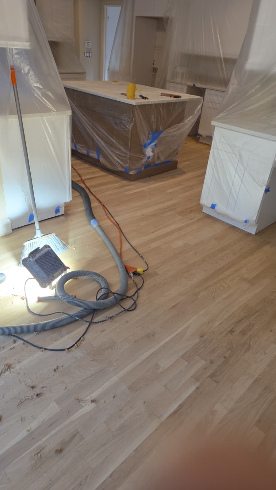 Professional hardwood floor restoration sanding with containment plastic prep in Rockmart GA