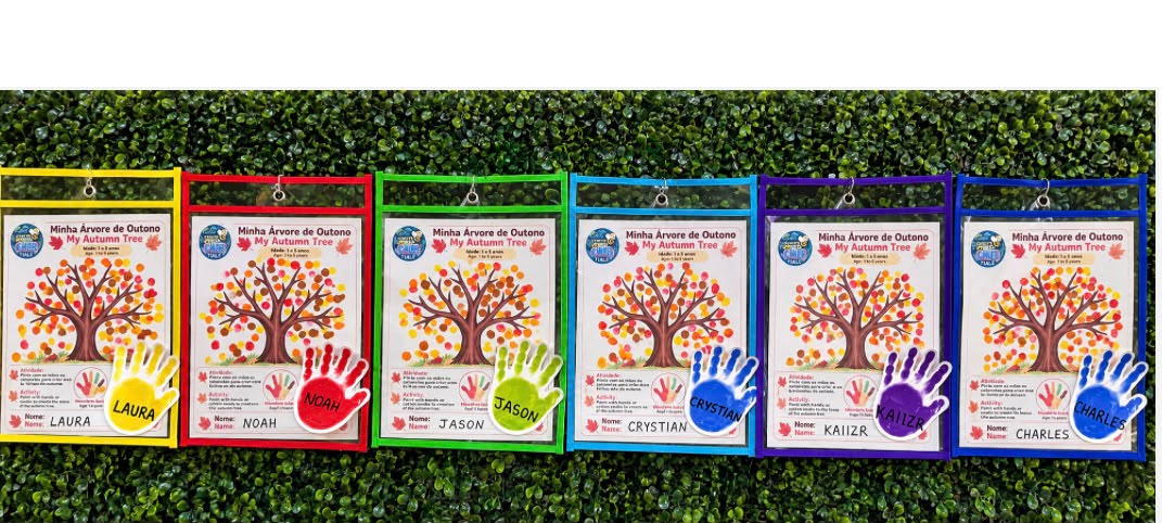 Autumn tree art creations with colorful children handprints