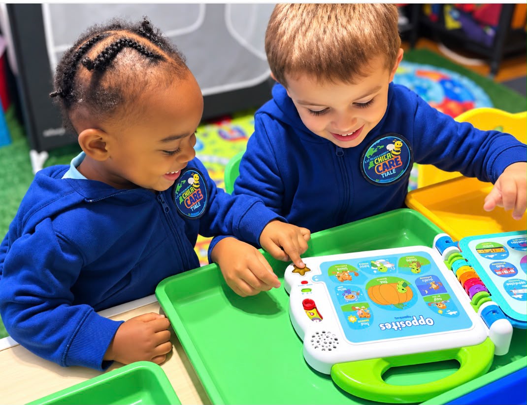 Children playing and learning cooperatively with interactive audio story book