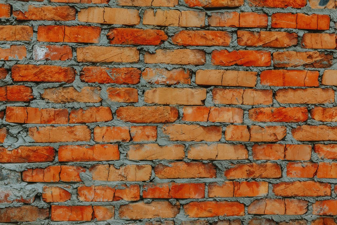 Aged brick wall surface for restoration and sealing