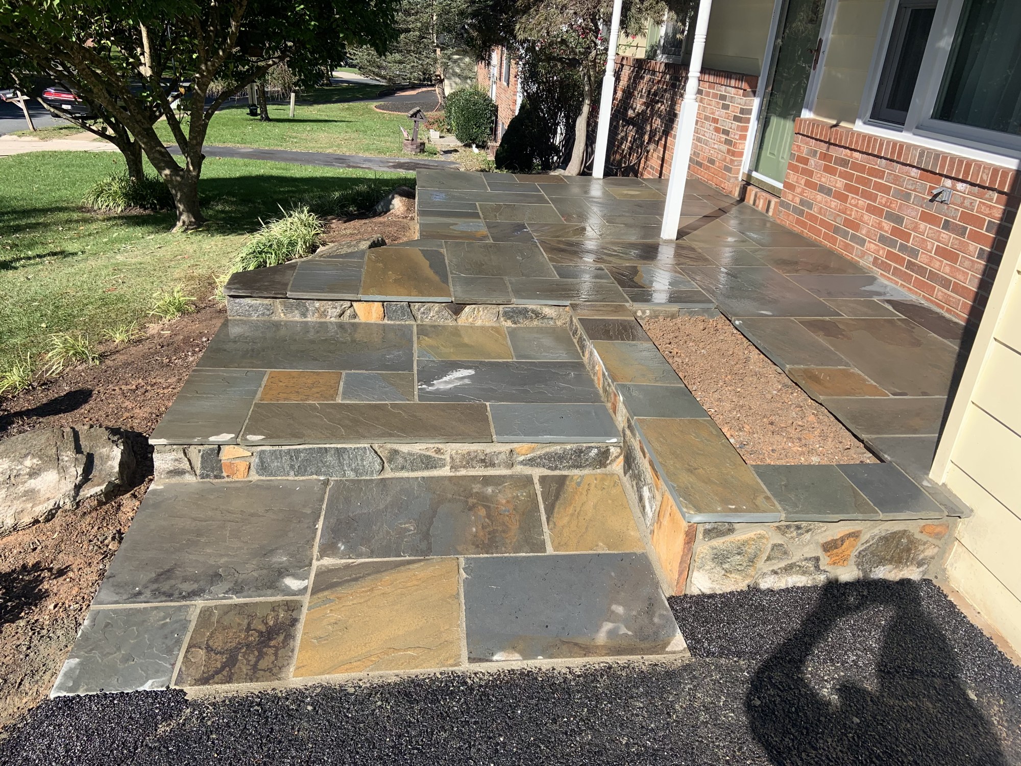 Natural stone facing and step border detail by Lionstone