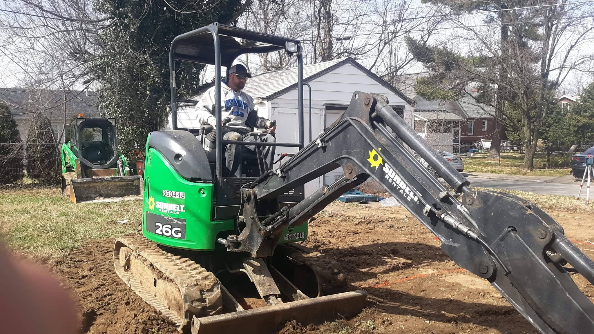 Mattingly Excavating owner operating compact excavator on a job site