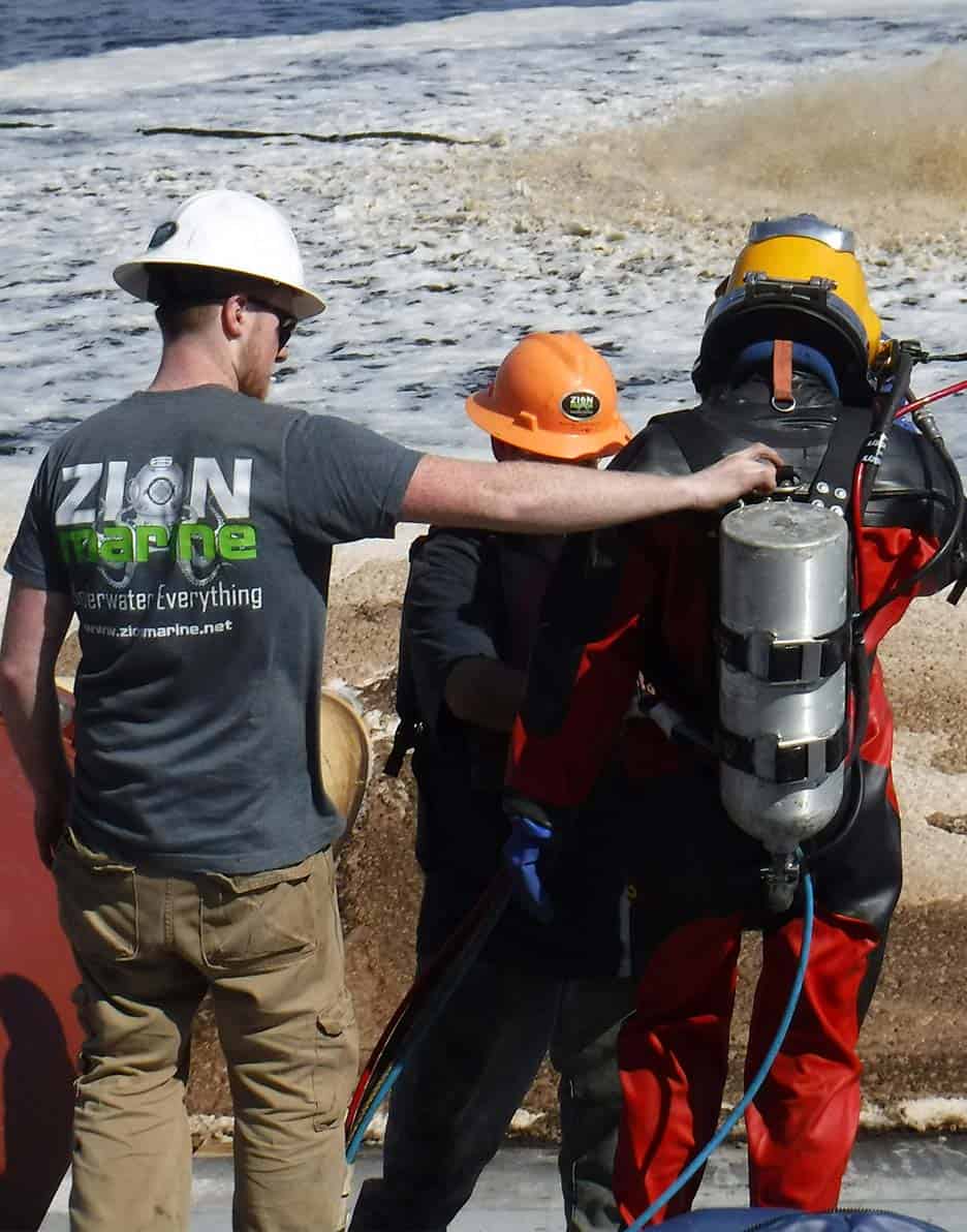 Commercial diving team at an infrastructure site.