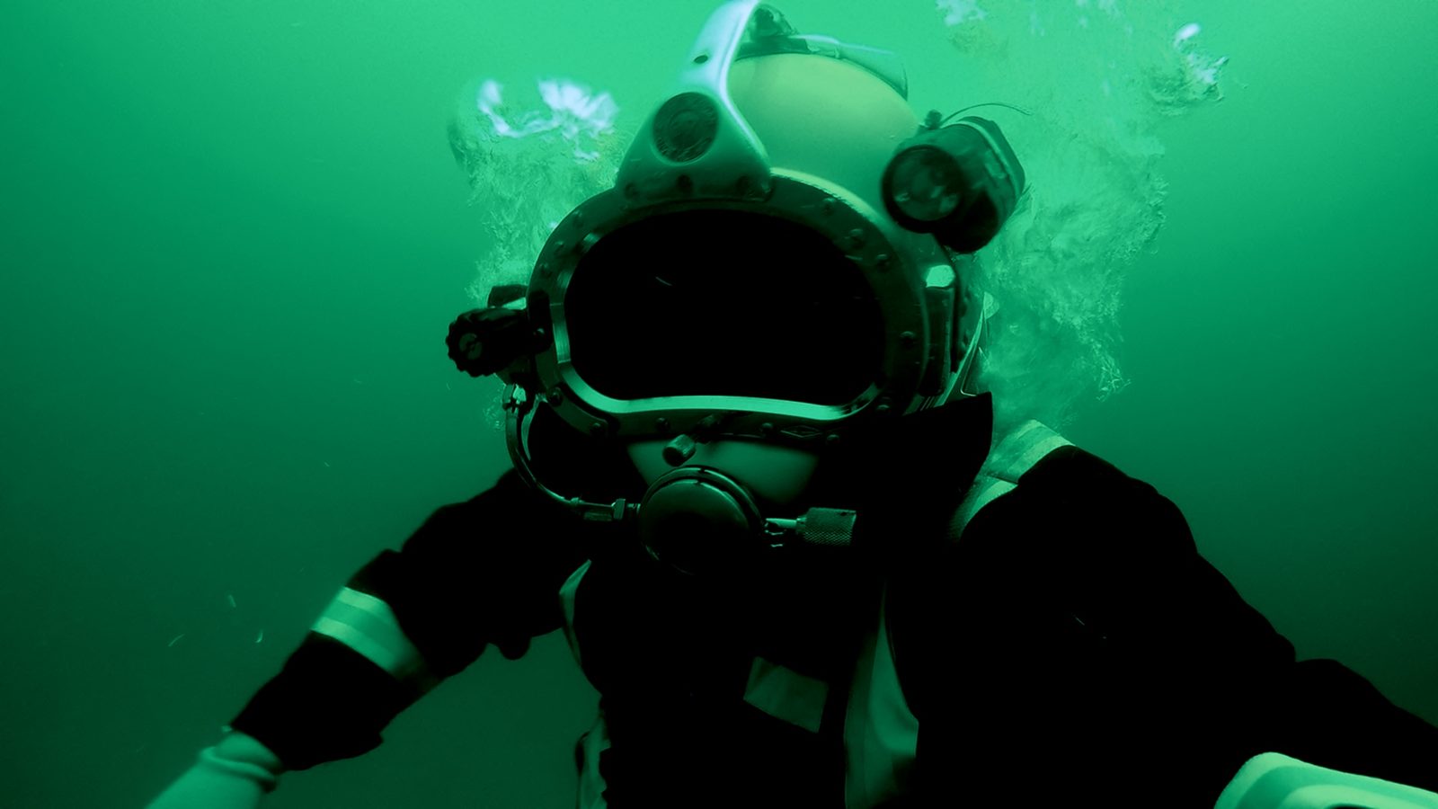 Diver in a teal helmet.