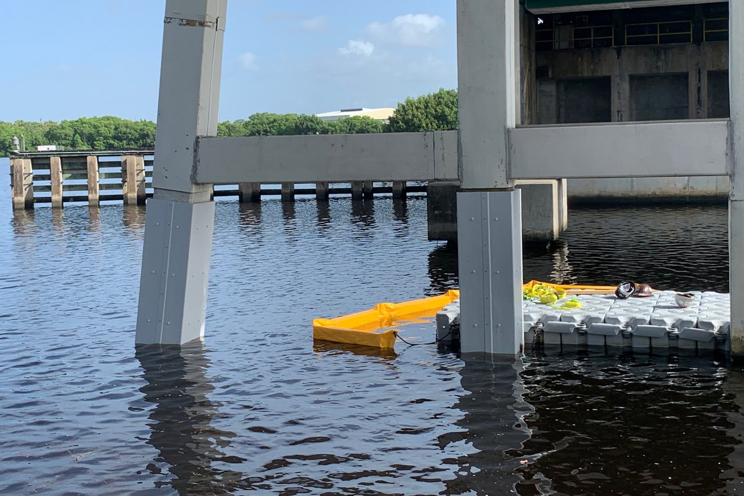 Installed pile jackets with a float dock and boom.