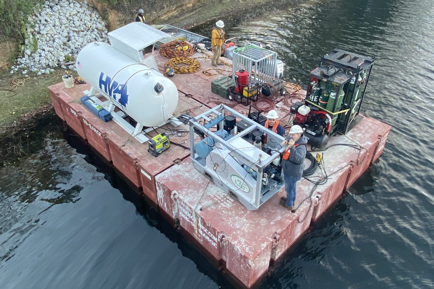 Dive spread and crew on a work barge.