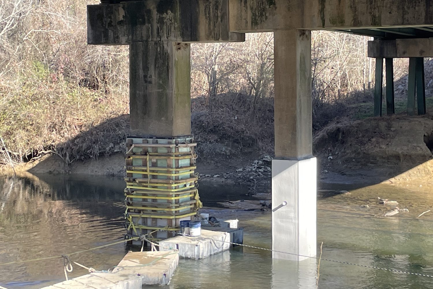 Concrete pile jackets on a Georgia DOT bridge pier, one finished and one in forms.
