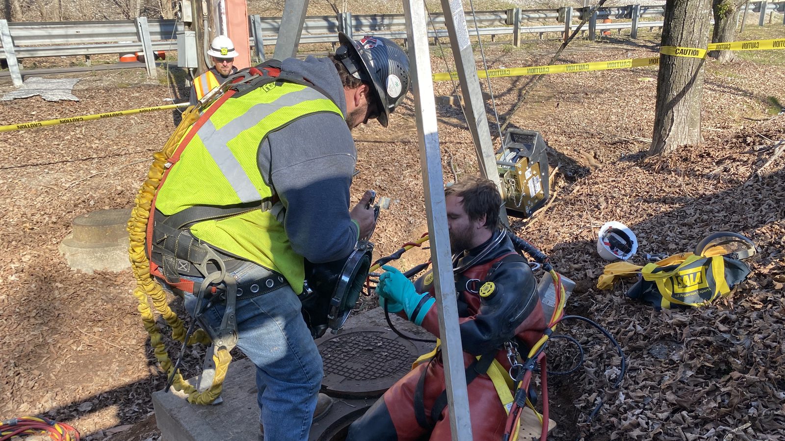 Diver entering a manhole at an operating facility.