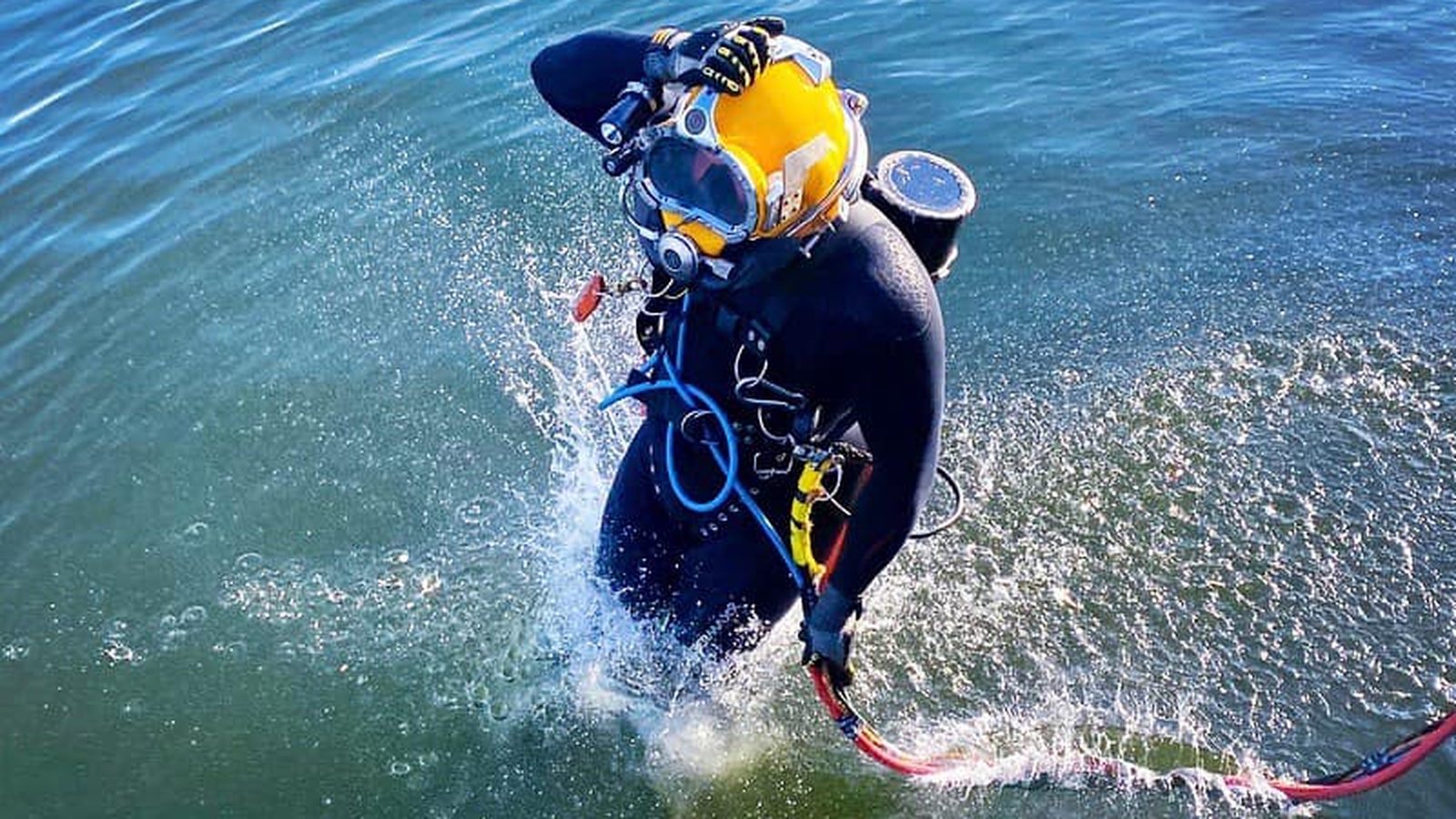 Commercial diver entering the water.