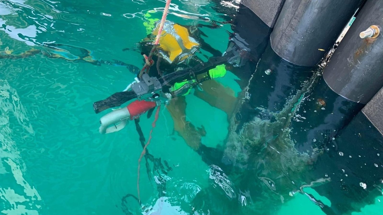 Diver installing a composite fender pile.
