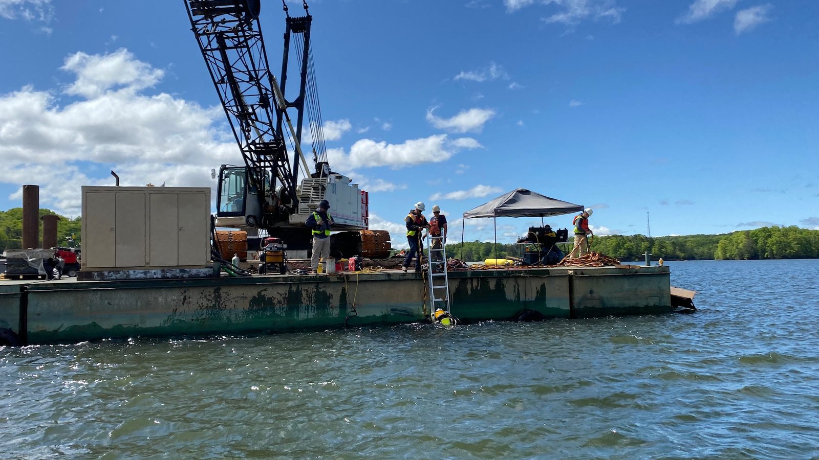 Crane barge working on a lake.