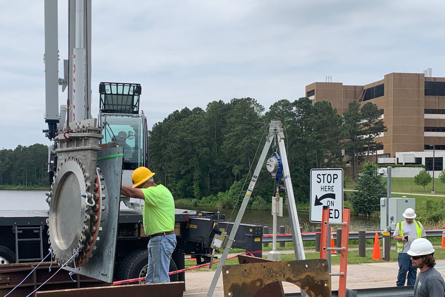Gate valve lifted by a crane.