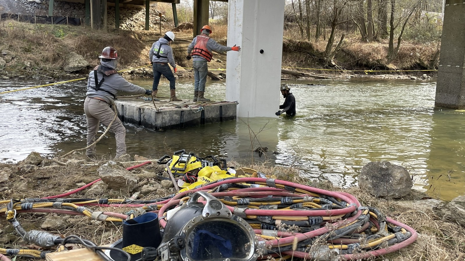 Commercial diver installing integral pile jackets on bridge piers over an inland river.