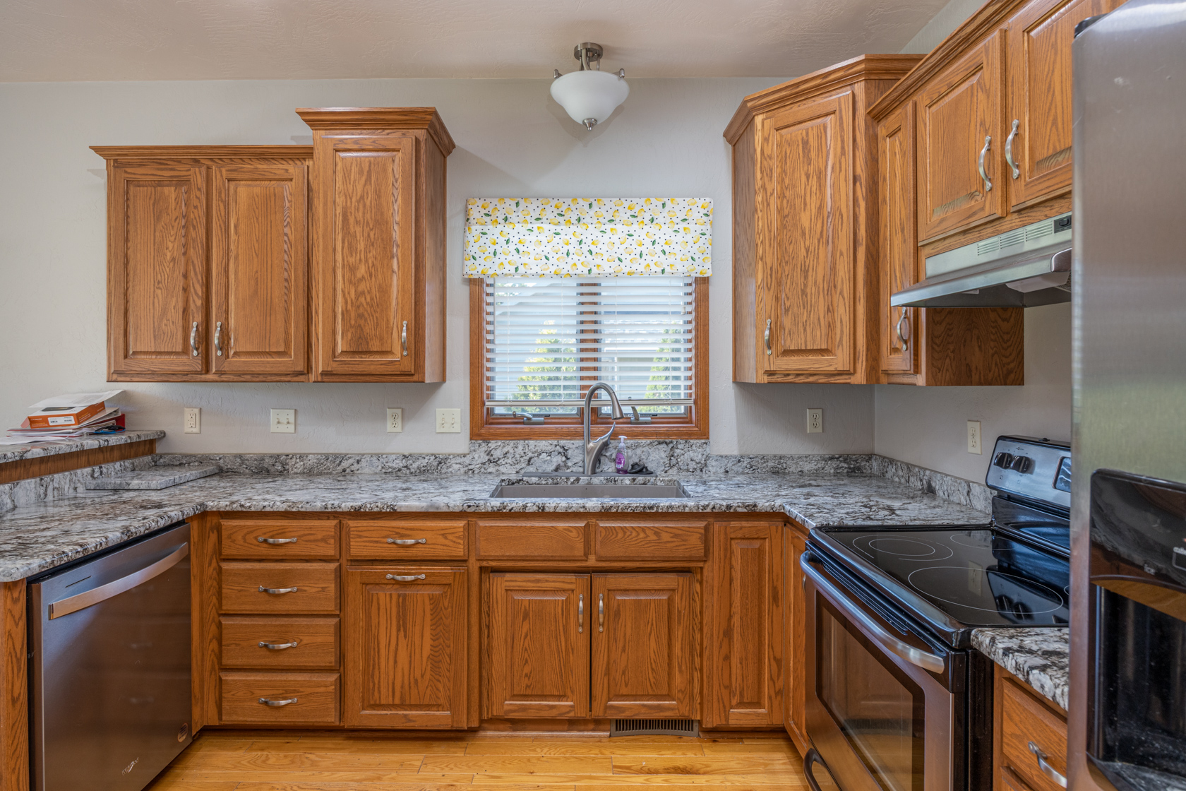 Kitchen & Dining Area with Hardwood Flooring