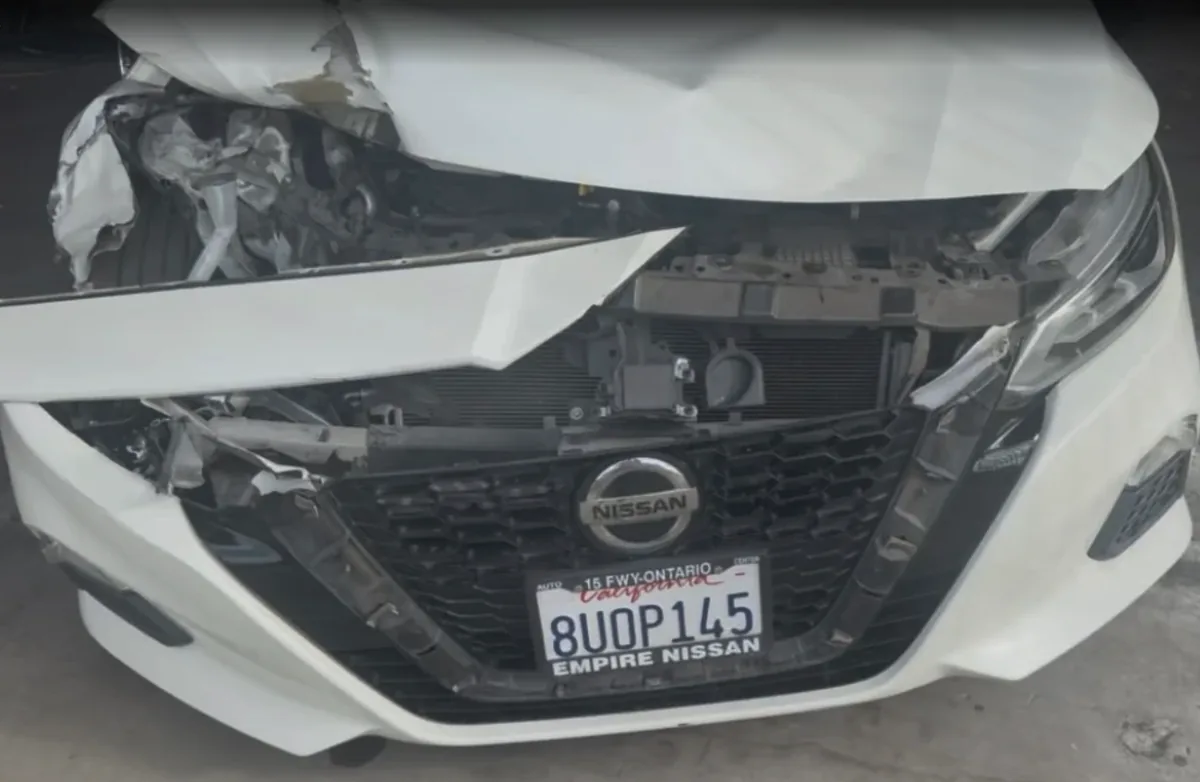 Nissan Altima front collision damage before repair at Focus On Cars Riverside