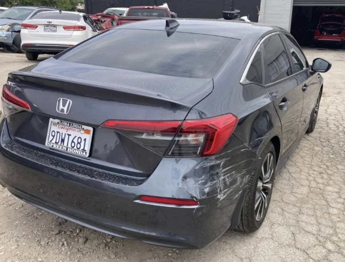 Honda Civic rear quarter panel damage before repair at Focus On Cars Riverside