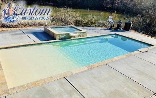 Modern Rectangular Pool with Tanning Ledge & Raised Spillover Spa