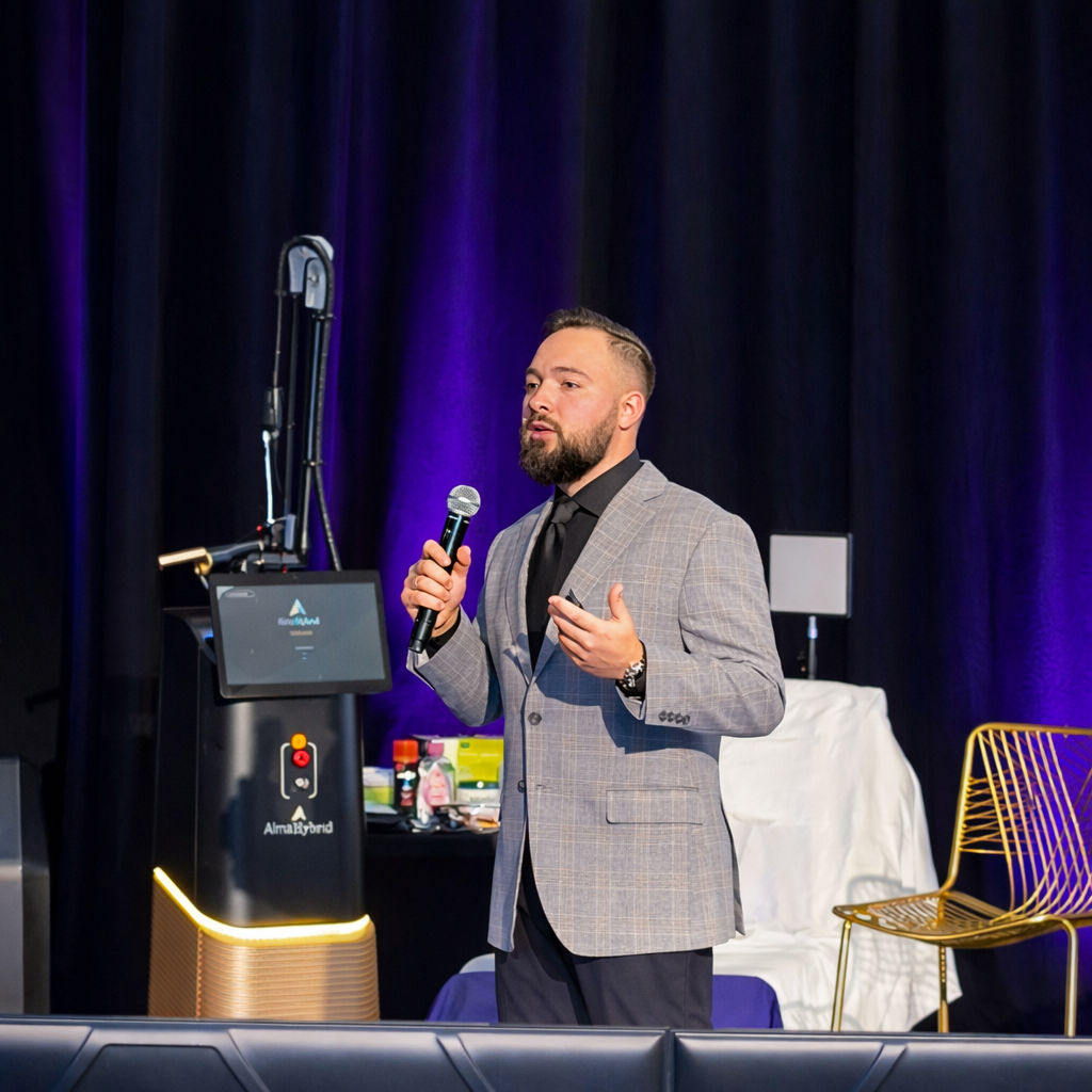 Jake Goldstein speaking on stage