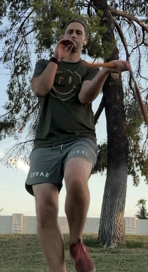 Christopher Hanson executing flexible weapon movement with oak nunchaku.
