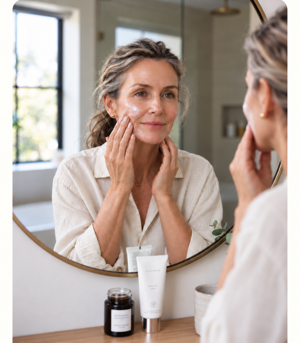 Woman applying moisturizer to dry midlife skin