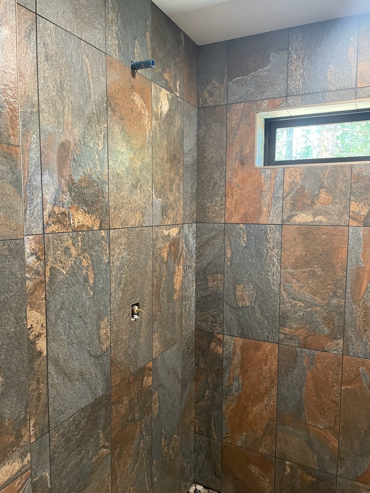 Tile shower surround built during a Bruin Builders bathroom remodel