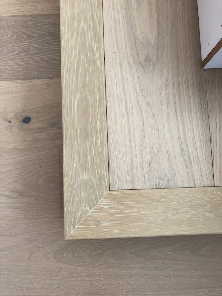 Picture frame border detail flooring by Bruin Builders
