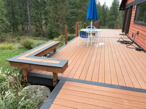 Custom deck with built in bench built by Bruin Builders in North Idaho