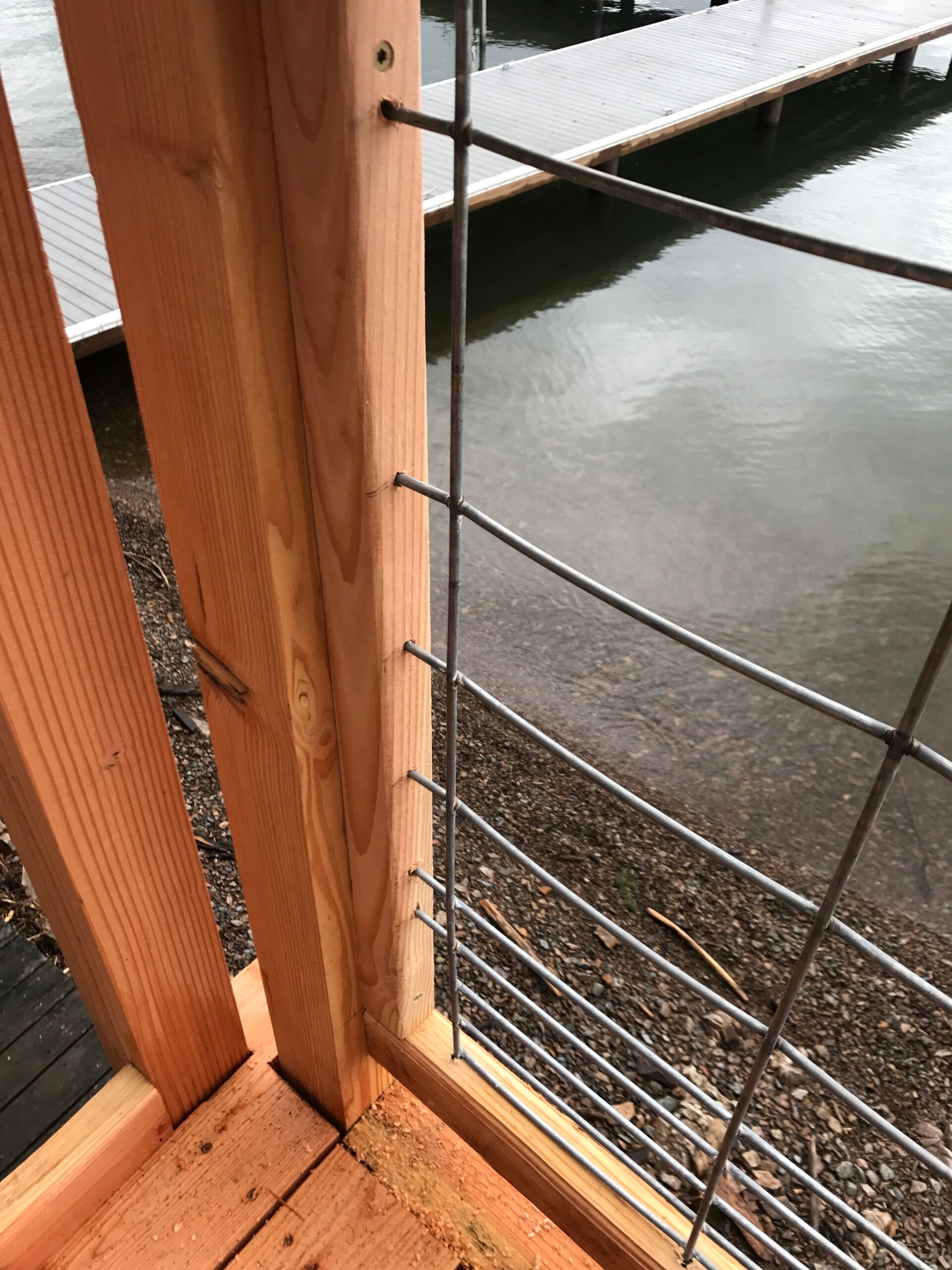 Wood and metal railing detail built beside the water