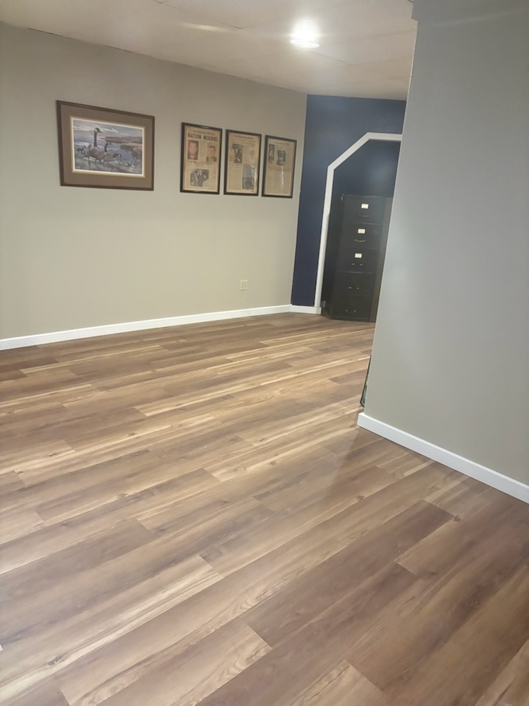 Finished plank flooring installed by Bruin Builders