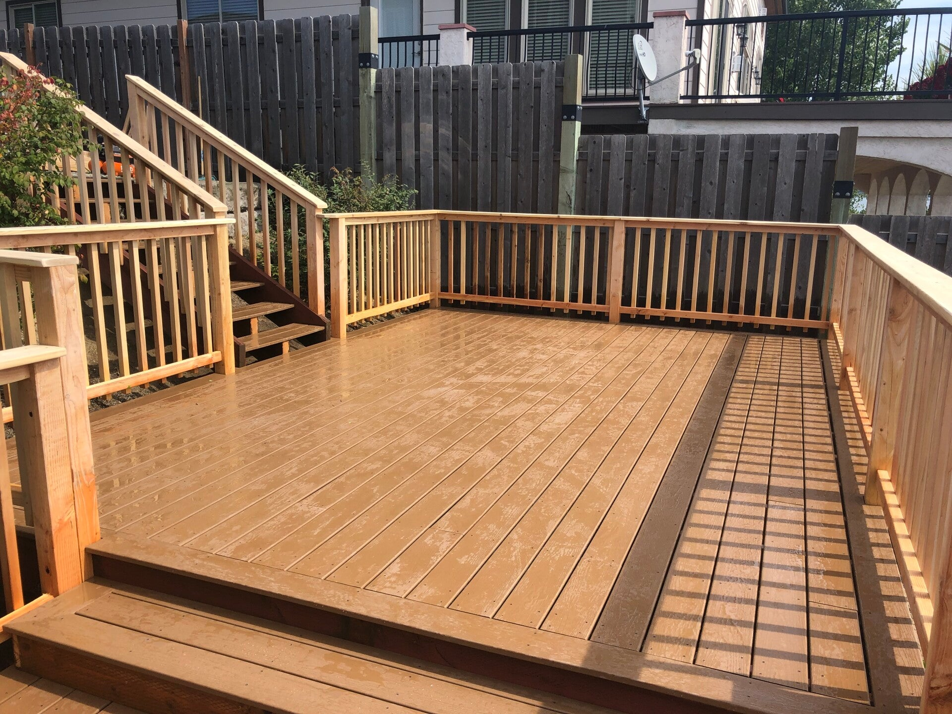 Deck with wood railings and stairs built by Bruin Builders
