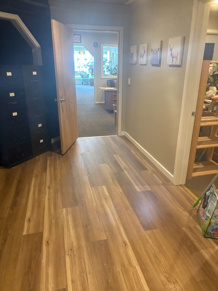 Hallway composite flooring install by Bruin Builders
