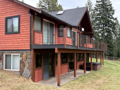 Home exterior before new siding with window trim