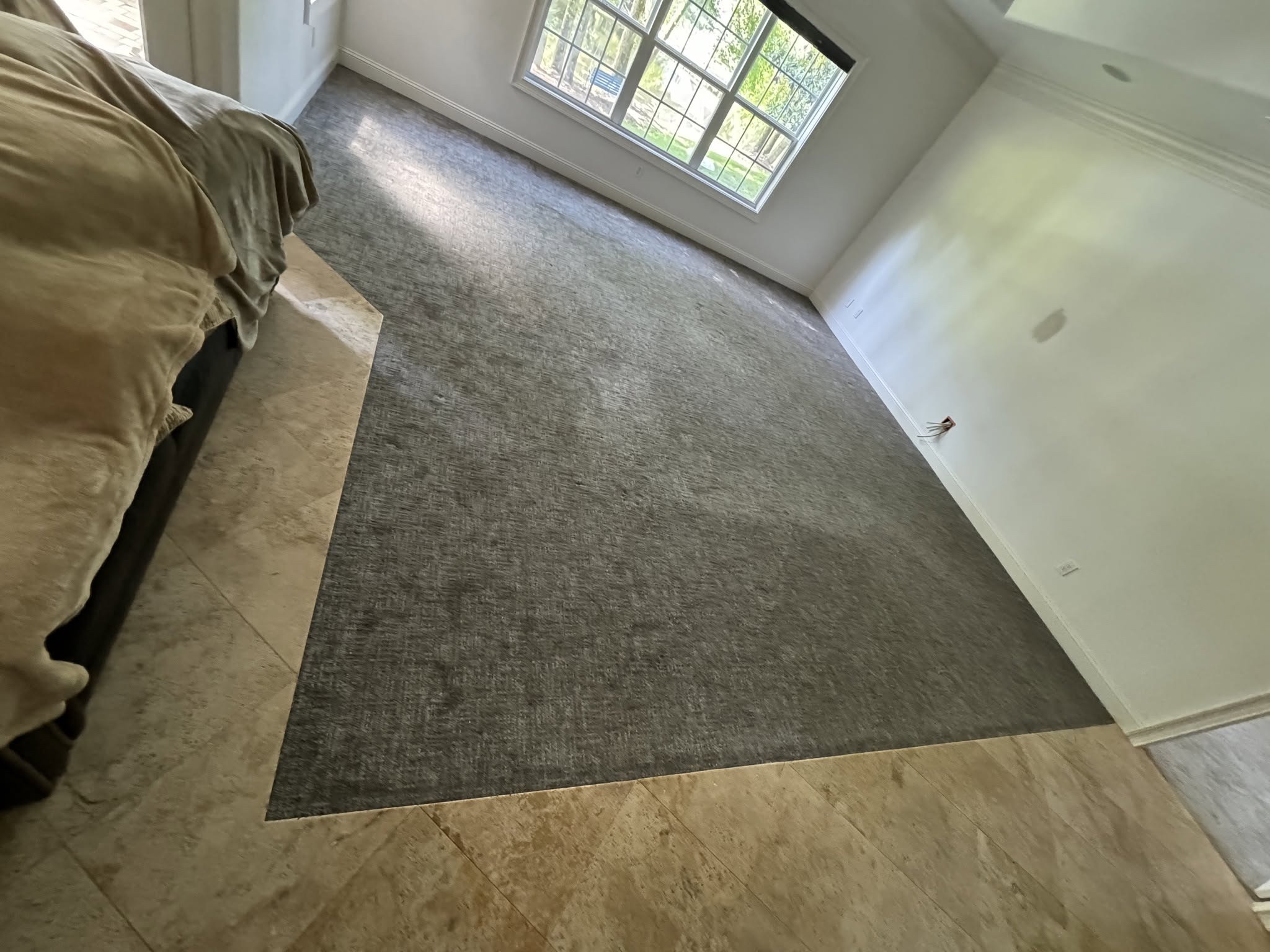 Area 1: carpet beside the existing travertine