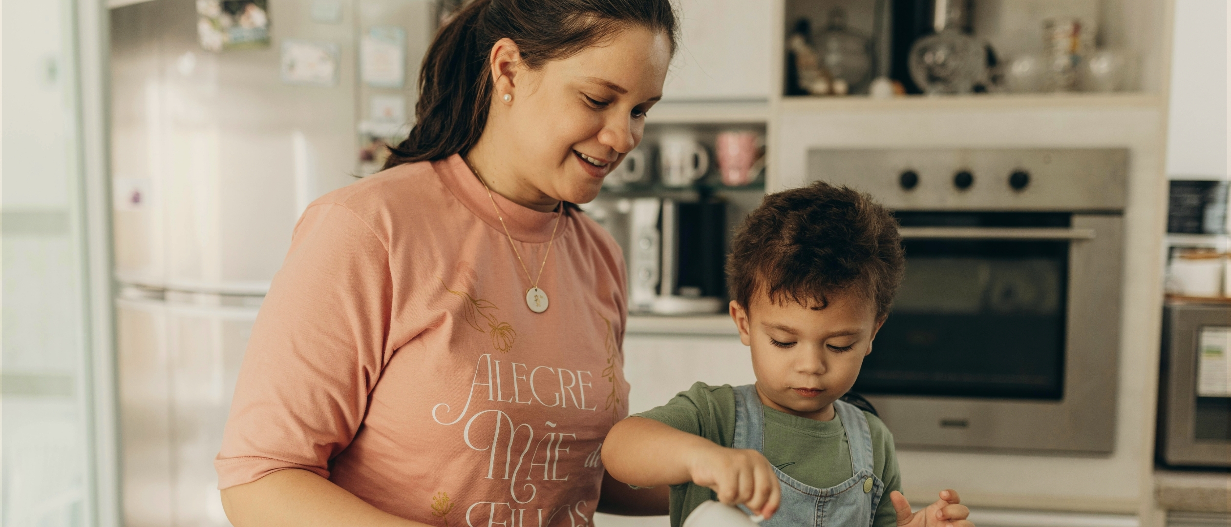 Mom and son cooking together in their kitchen
