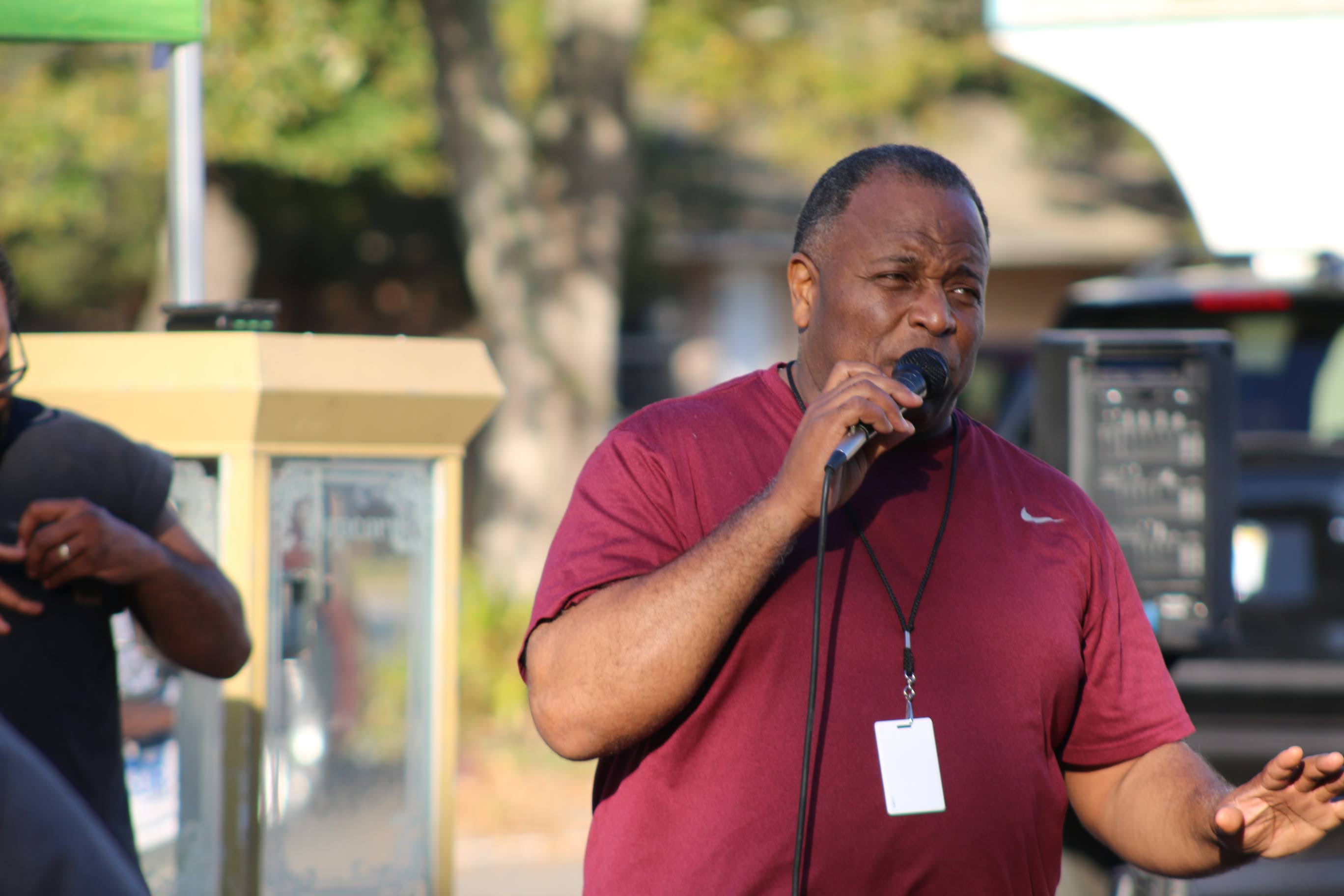 Alfred Johnson speaking directly to residents and families in the neighborhood