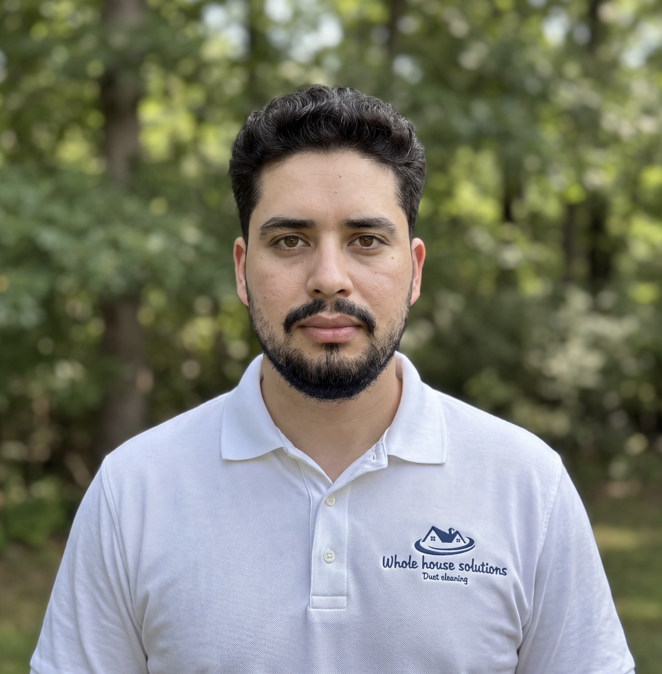 Isahi Zuniga, founder and owner of Whole House Solutions in Rockville MD wearing company uniform