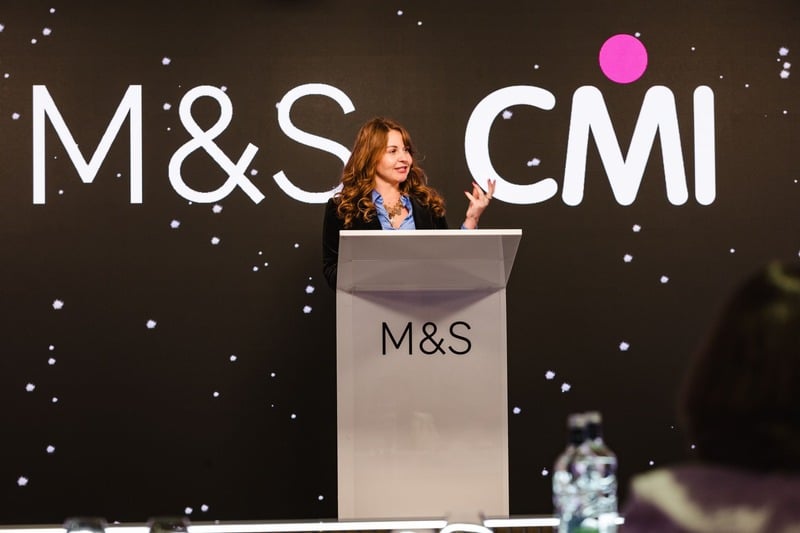 Rebecca presenting on stage