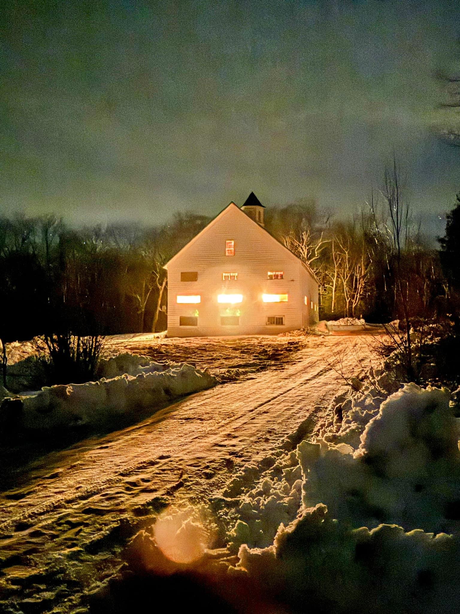 Harvest Nights illuminated barn gathering at dusk in Sheffield, Vermont