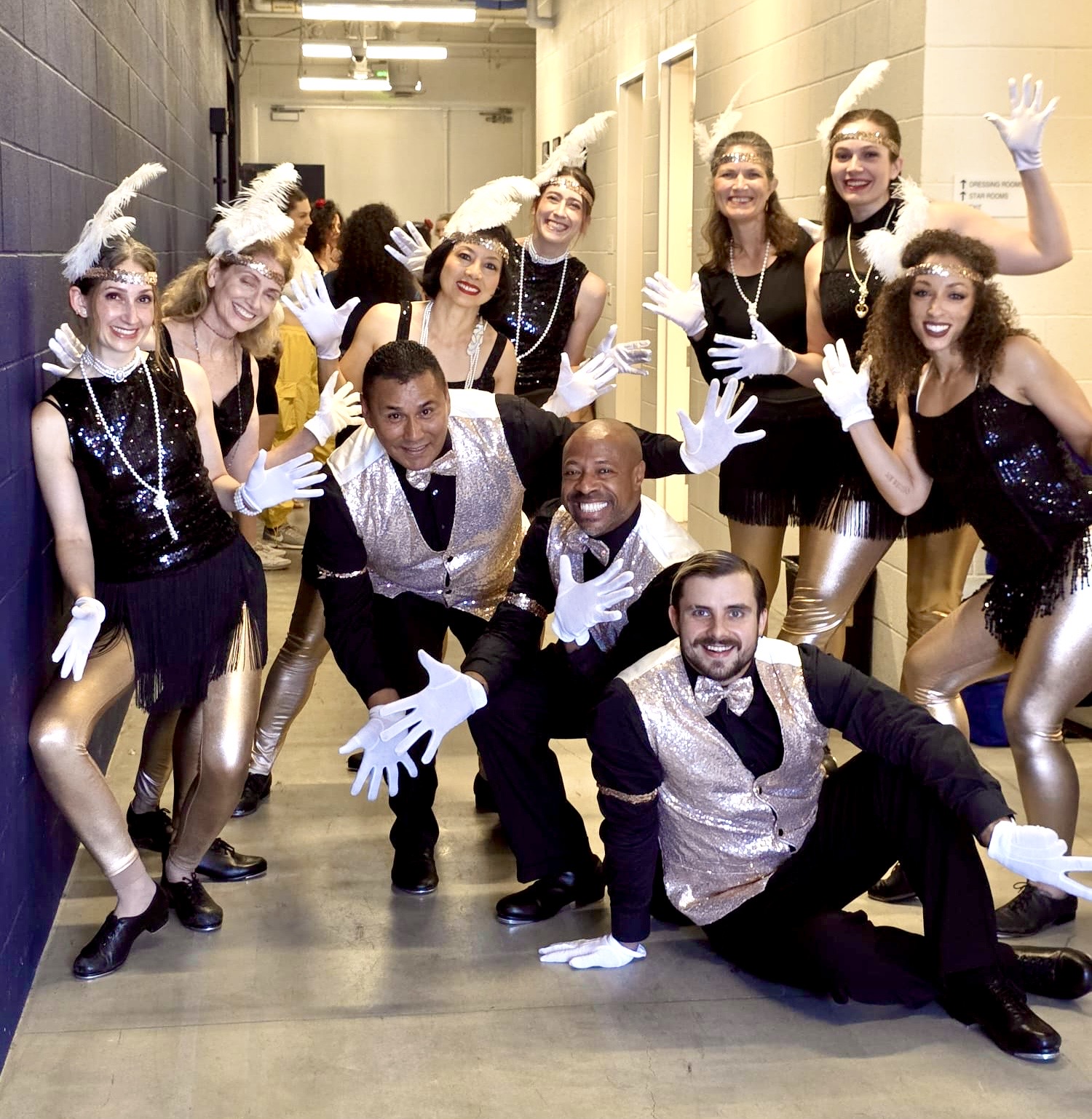Tap dancers in show costumes backstage