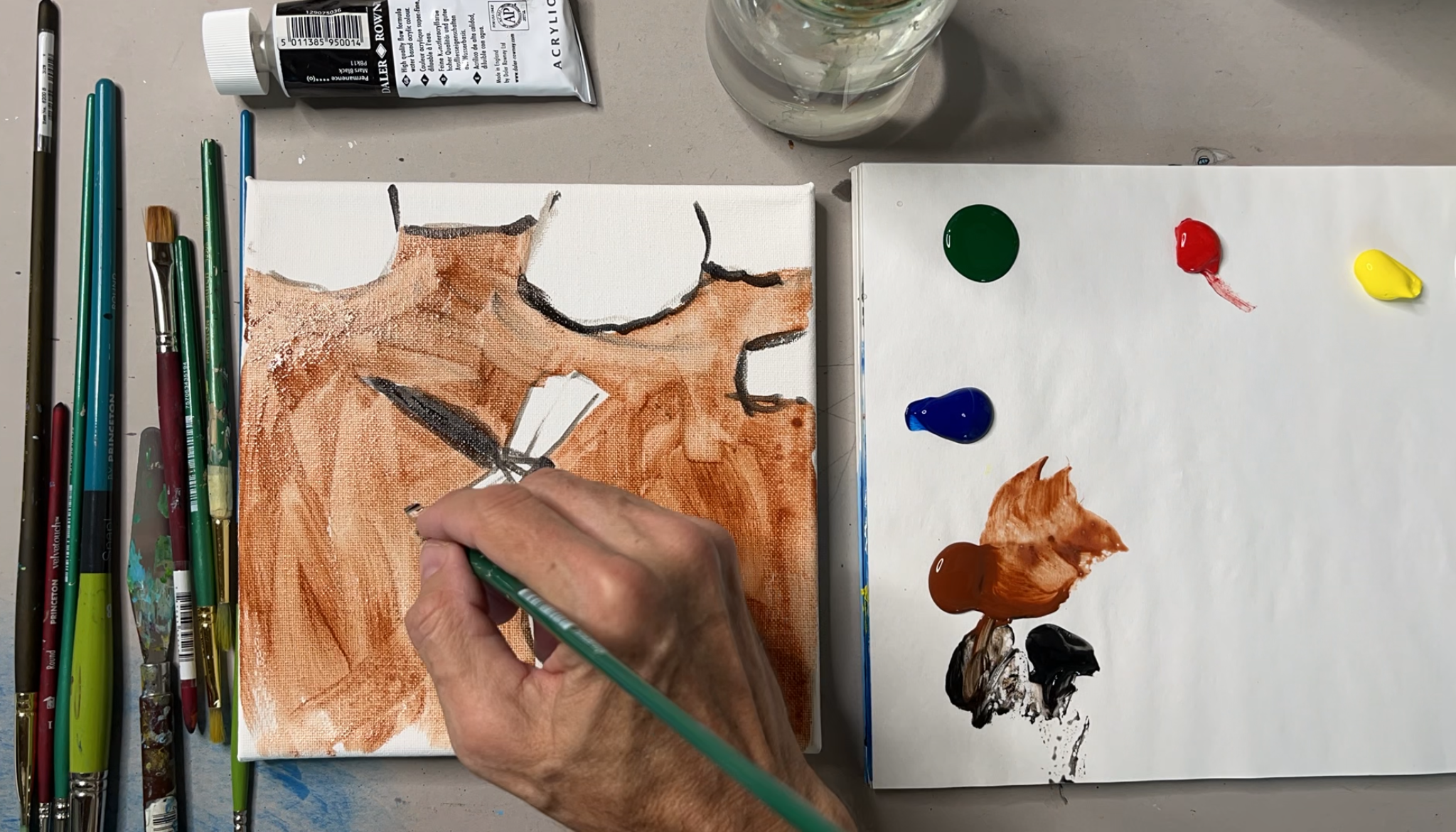 Artist workspace with painting supplies and palette