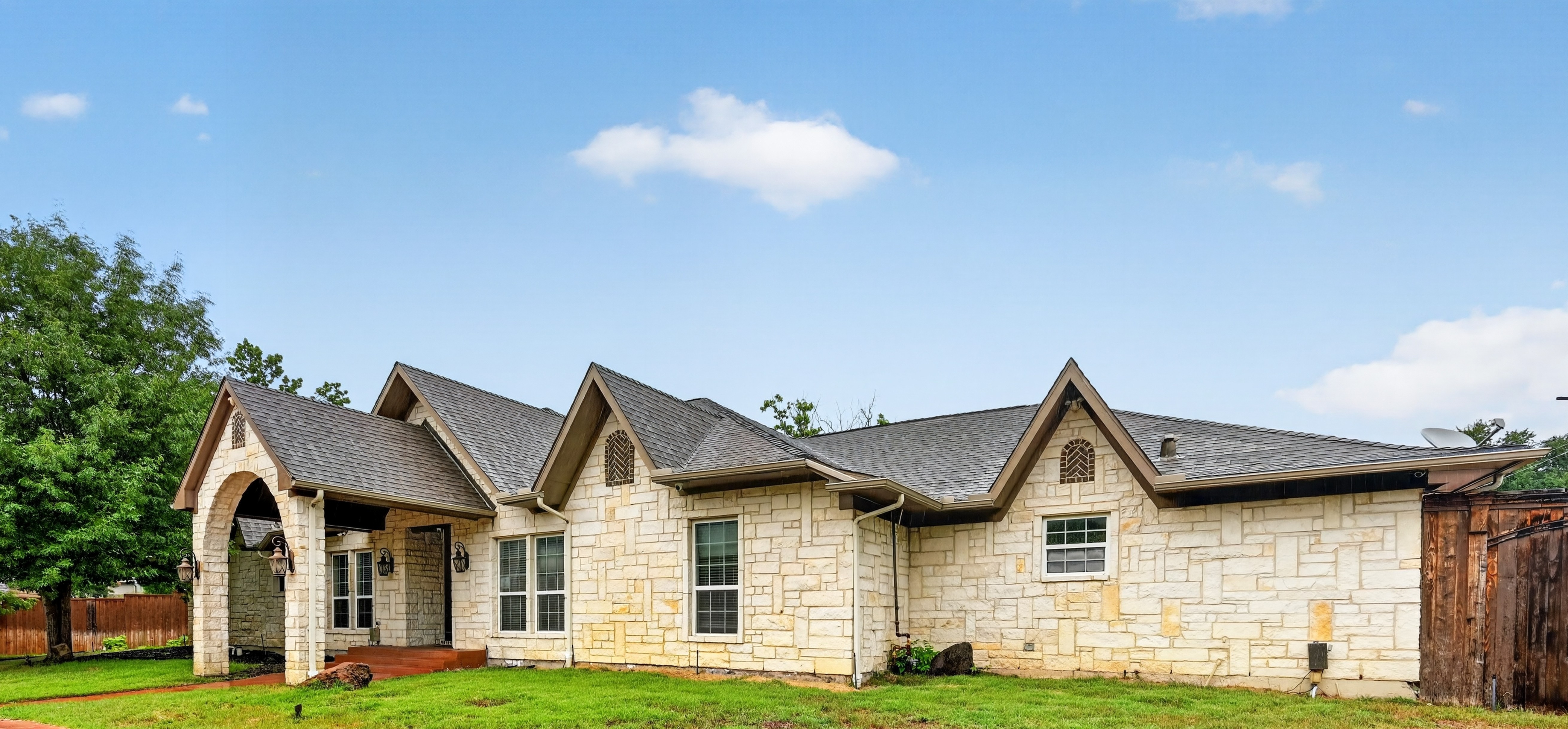 Main estate facade with Texas limestone and multiple gables