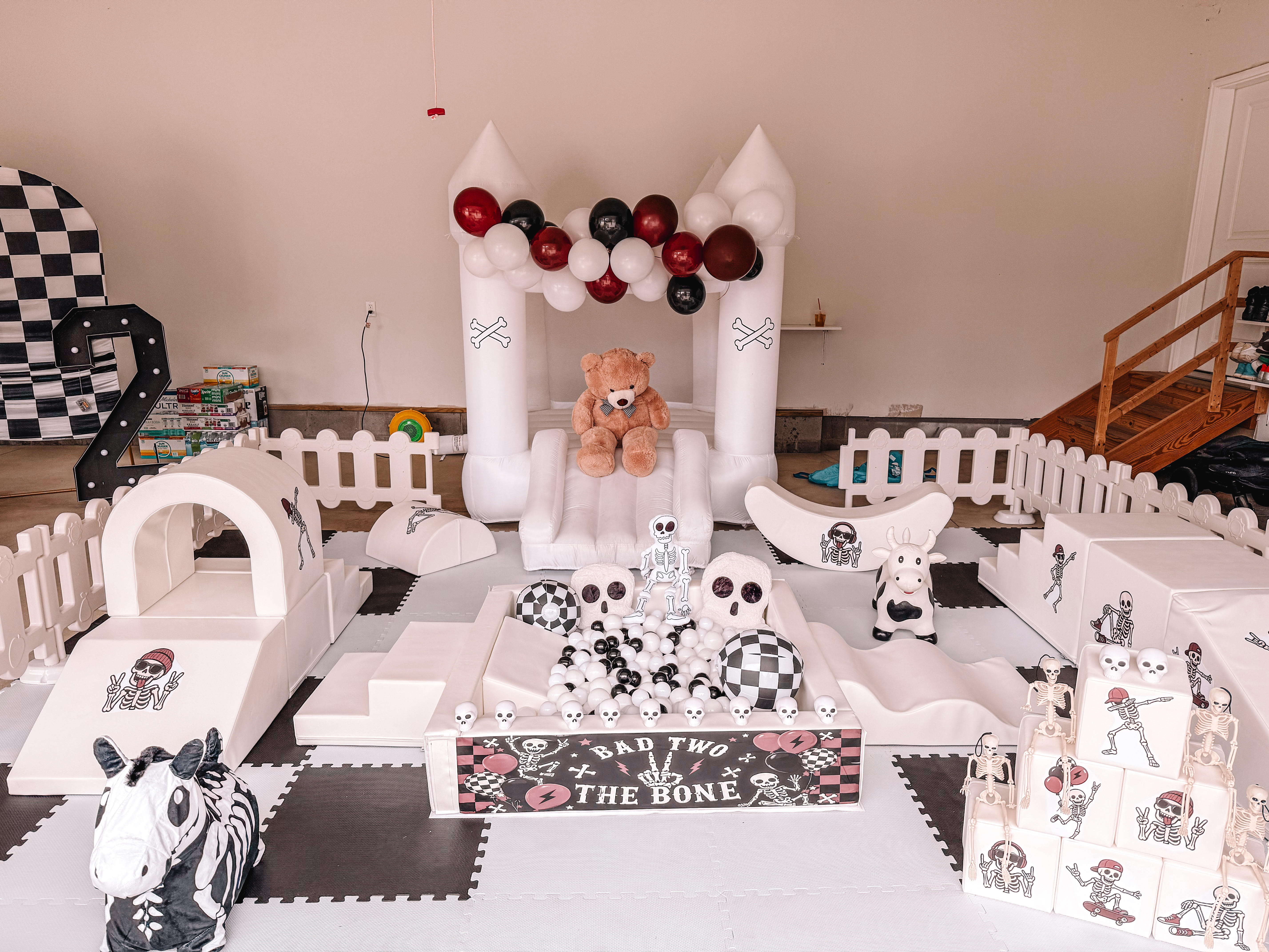 SoftPlayStudio luxury soft play setup with white bounce castle, ball pit, soft play climbers and custom theme styling