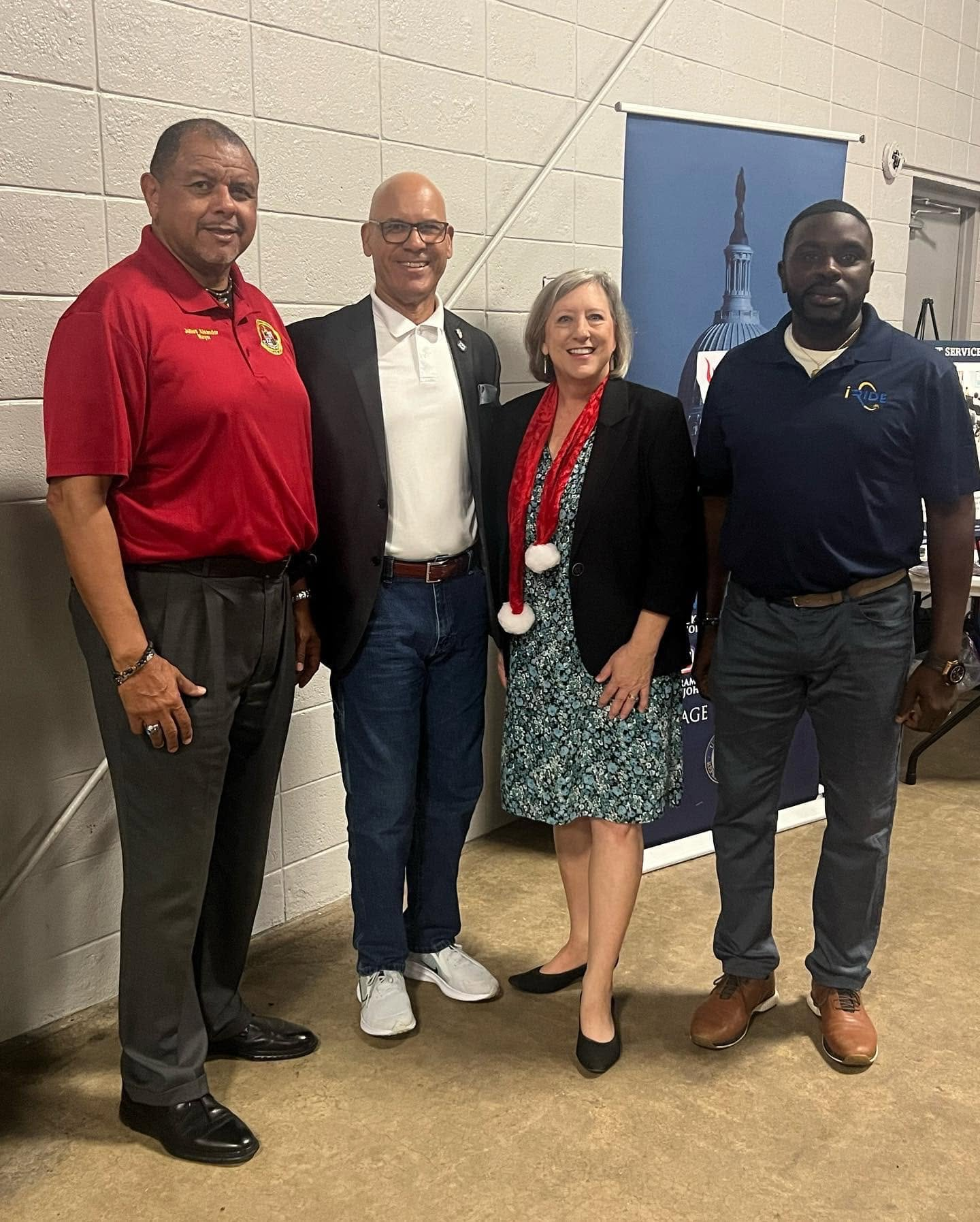 Cleveland Auzenne with local government and community leaders at an official event.