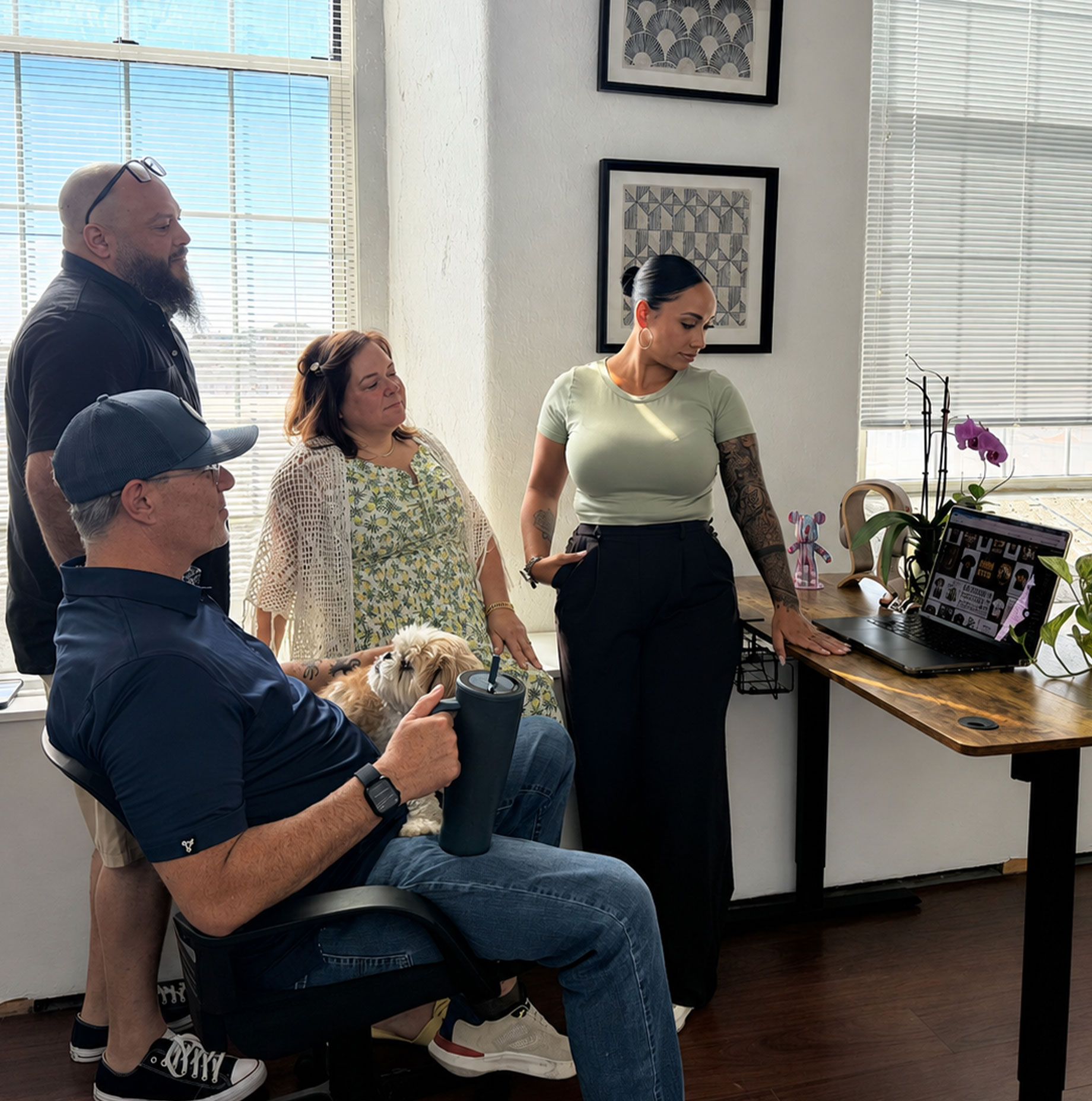 The Punch Creatives team collaborating in the Fall River, MA creative office — designers, developers, and marketers under one roof