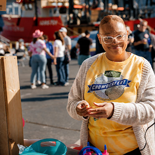 Candid photo of a vendor at Chowderfest outdoor event