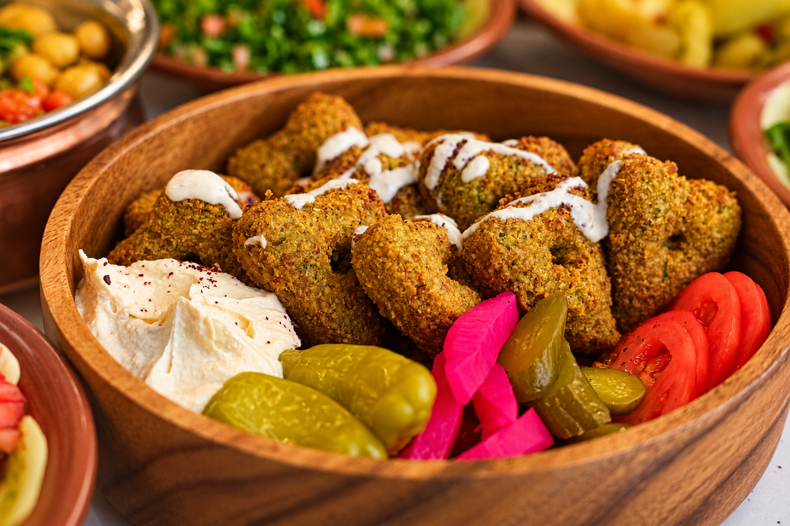 Original KIKI Heart Falafel Platter with tahina, pickles, and creamy hummus