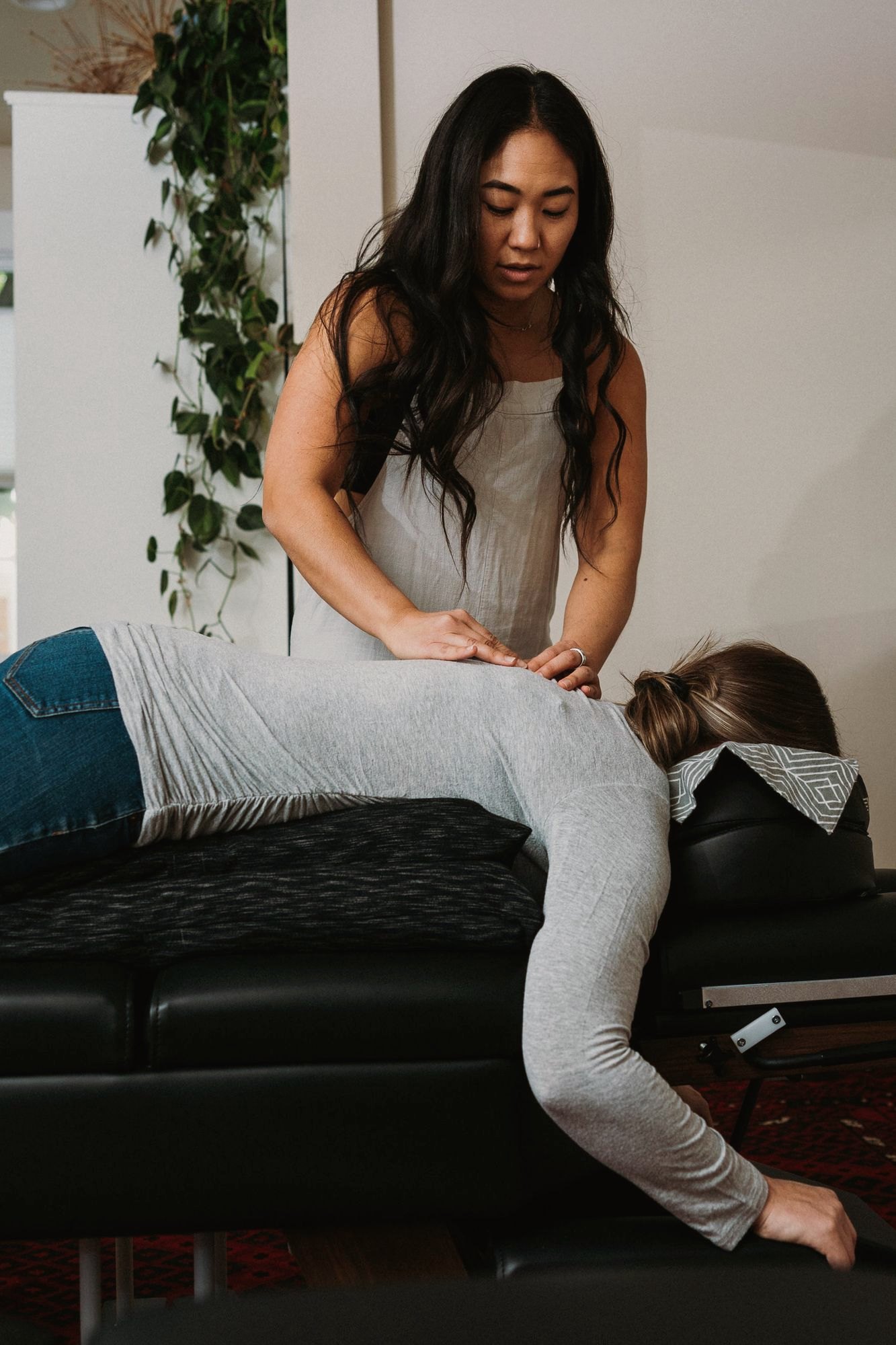 Dr. Kaitlyn Shikada focused on a gentle adjustment for an adult patient